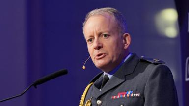 Sir Richard Knighton, in RAF uniform, addresses a defence conference