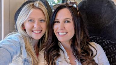 Friends smiling side by side