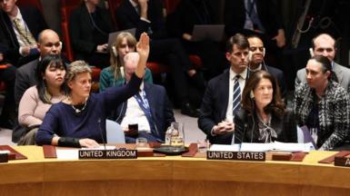  Barbara Woodward, Permanent Ambassador to the UN from the United Kingdom, raises her hand to vote during a United Nations Security Council meeting on maintenance of peace and security of Ukraine at the United Nations headquarters on 24 February.