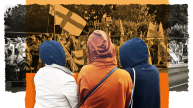 Composite image: Three women with hoods on in the foreground with their backs to the camera. In the background is a crowd behind barricades, with England flags visible at a public demonstration