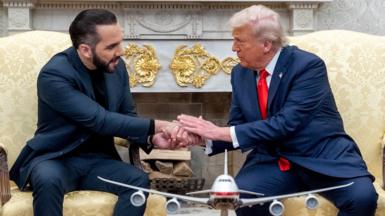 US President Donald Trump, right, and Nayib Bukele, El Salvador's president, shake hands during a meeting in the Oval Office of the White House
