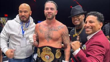 Paul Bamba poses for a photo with manager Ne-Yo after winning the WBA Gold Cruiserweight title 