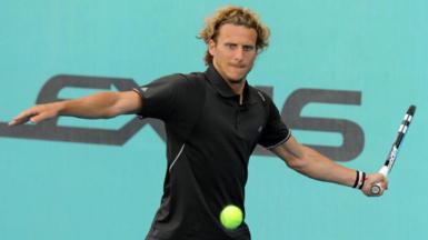 Diego Forlan hits a tennis ball