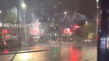Fireworks exploding on a double-decker bus in Birmingham