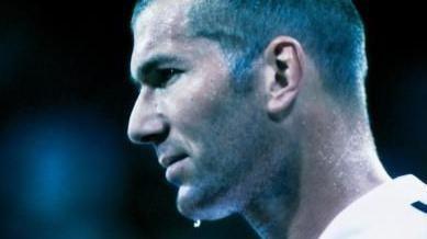 A side profile of Zinedine Zidane, with a white football shirt on