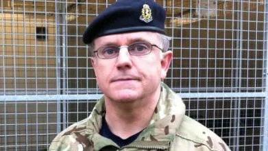 Ian Razzell pictured in army camouflage with a blue beret 