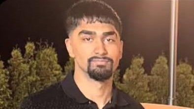 Mohammed Jibrael Mukhtar, wears black polo shirt