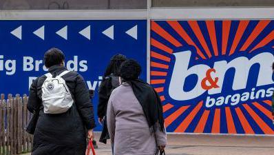 B&M Bargains store at Priory Square shopping centre on 21st March 2024 in Birmingham, United Kingdom. The picture shows the logo and people outside the shop.