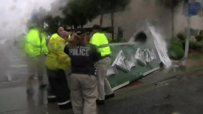 Police move fallen sign