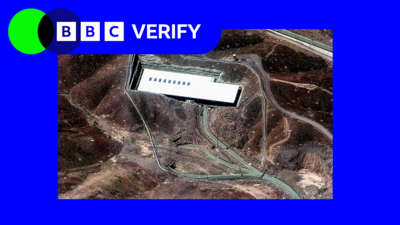 In the background: A satellite image of Iran's Fordo nuclear site. A BBC Verify logo is in the top left-hand corner. 