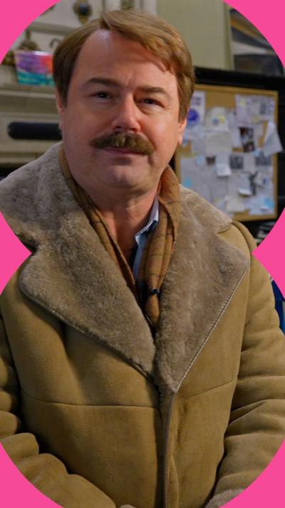 Danny Dyer in costume looks at the camera. 