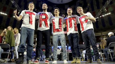 Trump supporters wear T-shirts with his name on at a rally in Lynchburg, Virginia