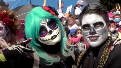 Parade revellers celebrate Day of the Dead in Mexico City