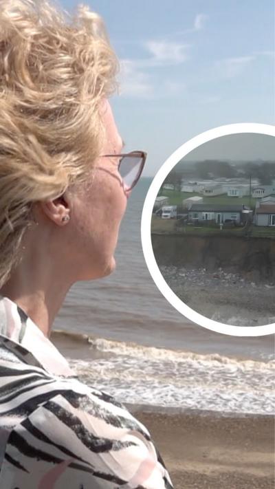A woman with blonde hair and glasses looks out to see from a cliff edge. An inset image shows holiday chalets and caravans close to the edge of a cliff top. Below them is a sandy beach with white stones and the tide coming in, which is foamy and white.