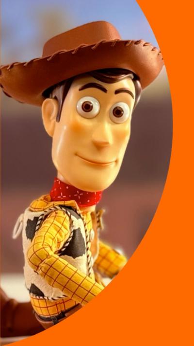 Andy from Toy Story looks to the camera.