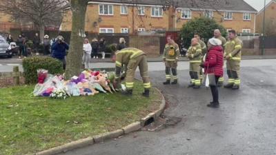 Firefighters with flowers