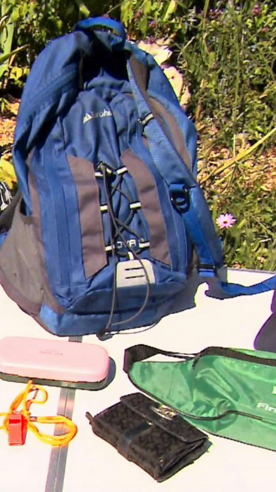 A rucksack and items displayed on a table