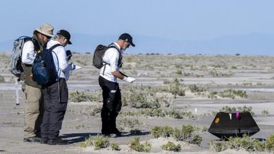 Teams approach the capsule