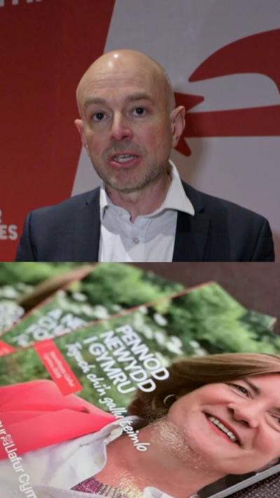his picture is split in half, on the left side there is a man in a black suit with a white shirt is stood in front of a red wall with white lettering and logo. On the right hand side is a picture of the First Minister spread on a manifesto cover for Welsh Labour, the background on the manifesto cover has green bushes, grass and white flowers.