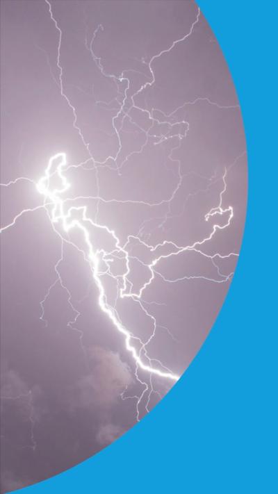 Bright lightning strike cuts through dark skies