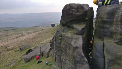 Firefighters free sheep trapped between rocks