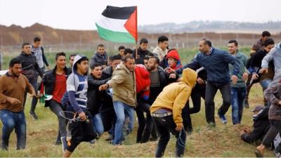 Twelve people have been killed in clashes on the Gaza-Israel border.