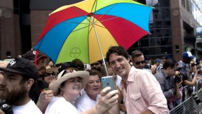 Prime Minister Justin Trudeau poses for a photo gay pride march in Toronto on 3 July