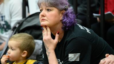 Woman at town hall hearing