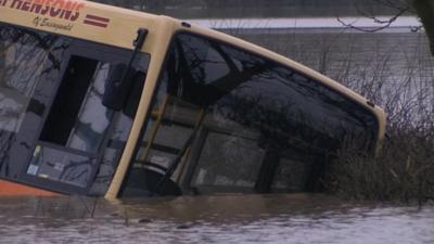 Bus trapped in flood water near York