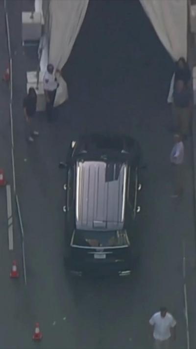 A black SUV drives into a tent in Madison Square Garden