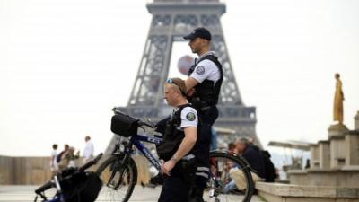 Police officers near the Eiffel Tower, Paris