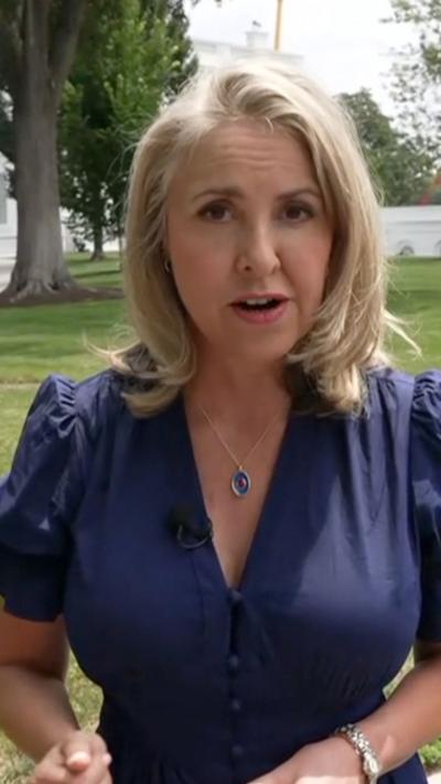 Sarah Smith stands outside the White House as she speaks to the camera