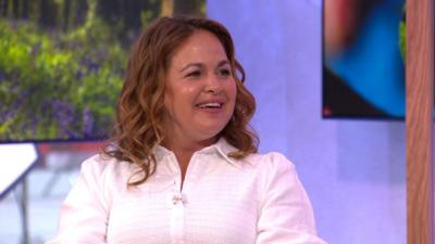 Giovanna Fletcher in The One Show studio. She wears a white shirt