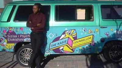 Counsellor Andreas Banetsi Mphunga in front of his van in Cape Town, South Africa