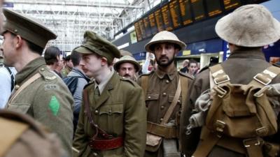 Volunteers dressed as soldiers