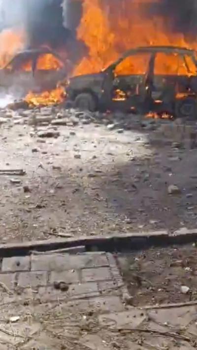 Image of a burnt out car in tehran