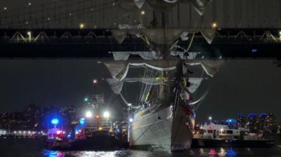 Damaged ship next to bridge 