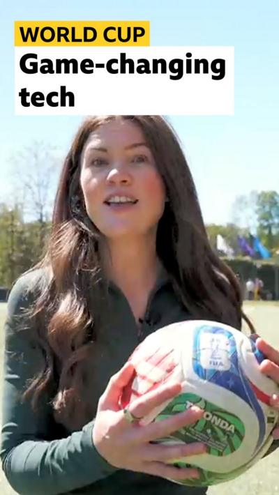 Reporter Shiona McCallum holds a 2026 World Cup football showing an opening where a microchip is housed. 