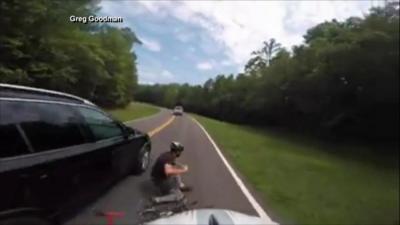 The cyclist seen tumbling after the collision