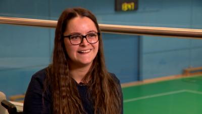 Kayleigh Haggo sits in a boccia training facility