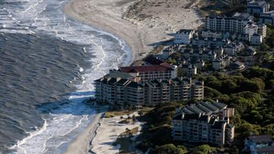 A new photography book captures the environmental threat to America's coastal region.