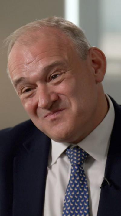 Sir Ed Davey wearing a blue tie, white shirt and a black blazer.