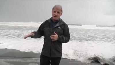 Correspondent Jonathan Head in Luzon Island on a beach as a storm approaches