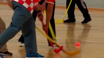 Playing indoor hockey at the club in East Kilbride