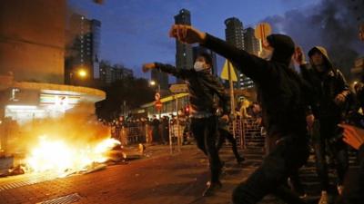 Rioters throw bricks at police