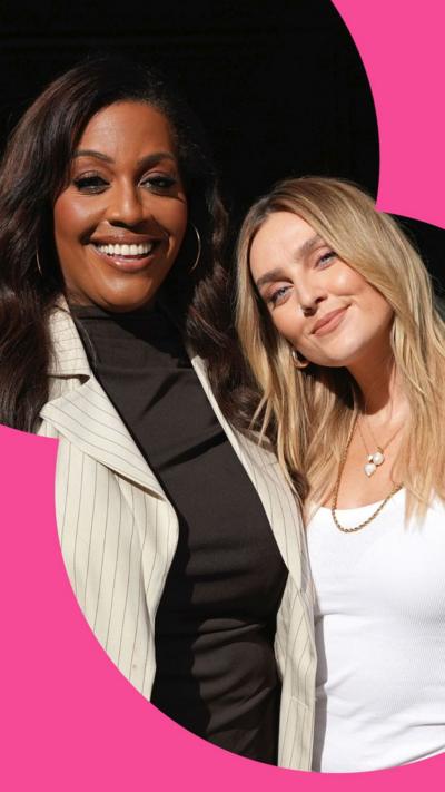 Alison Hammond and Perrie Edwards smiling at the camera