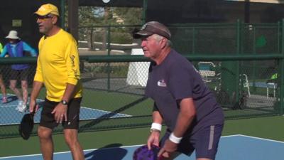 Men playing racquet ball