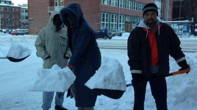 Migrants clearing snow in Finland