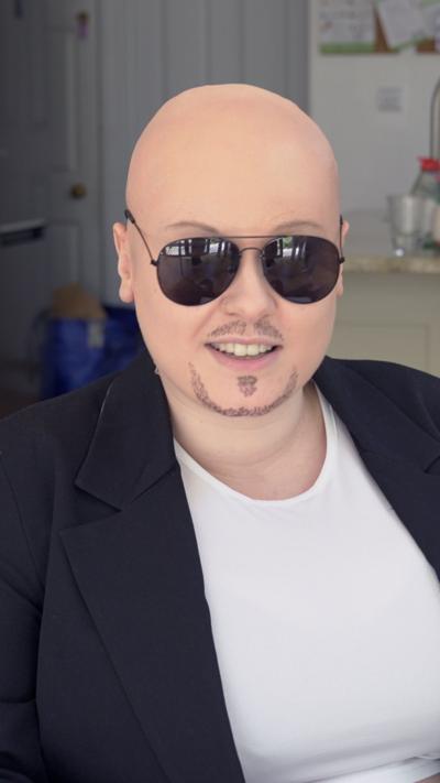 Woman dressed as the singer Pitbull