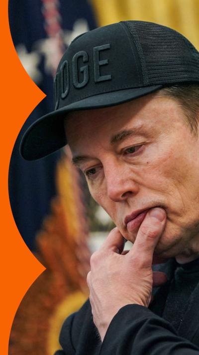 Elon Musk looks pensive while standing in the Oval Office
